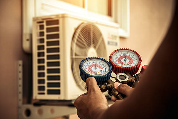 Professional Air Conditioning Service technician working in Milford, IN